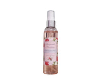 Fragrance mist bottle with floral design on a white background