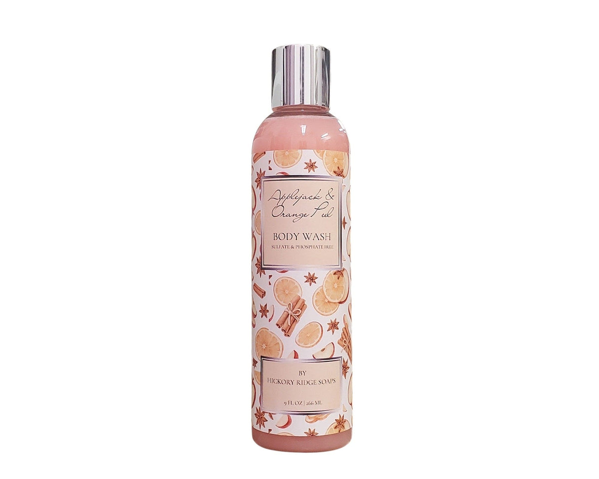 Body wash bottle with cinnamon and orange design on a white background
