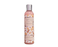 Body wash bottle with cinnamon and orange design on a white background