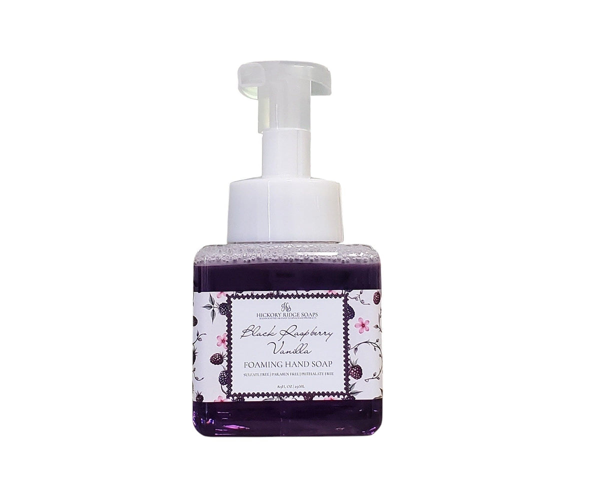 Foaming hand soap bottle with black raspberry and vanilla label on a white background