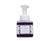 Foaming hand soap bottle with black raspberry and vanilla label on a white background