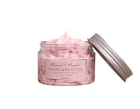 Pink whipped body butter jar with a white background
