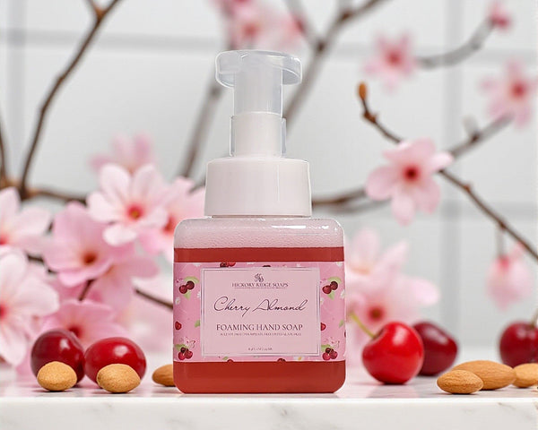 Cherry Almond foaming hand soap bottle with cherry and almond decorations on a floral background