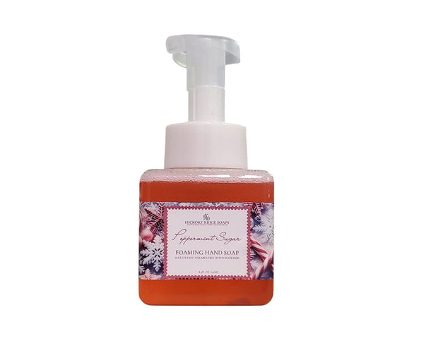 Foaming hand soap bottle with peppermint sugar flavor on a white background