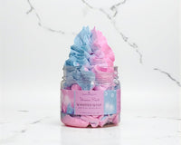 Jar of pink and blue whipped soap on a marble surface