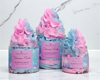 Three jars of 'Unicorn Farts' whipped soap with pink and blue swirls on a marble surface.