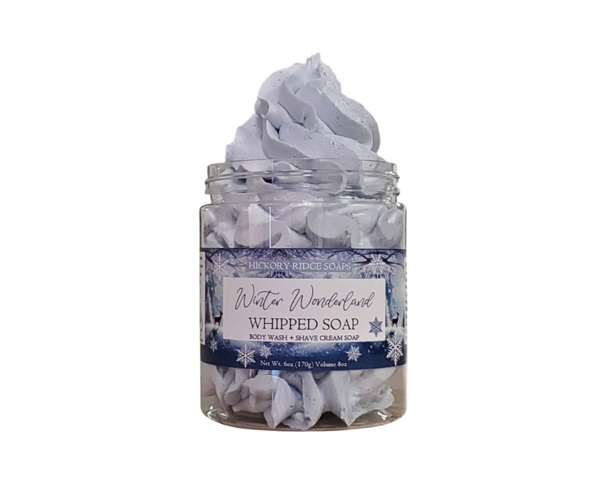 Jar of whipped soap with a label on a white background