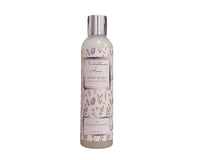 Body wash bottle with floral design on label against a white background