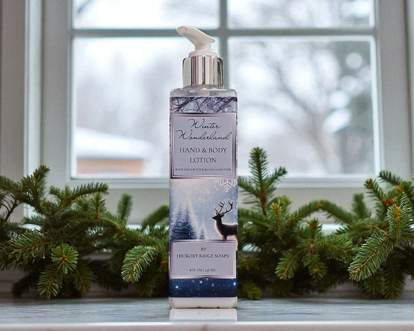 Hand and body lotion bottle with winter-themed design in front of a window with Christmas decorations.