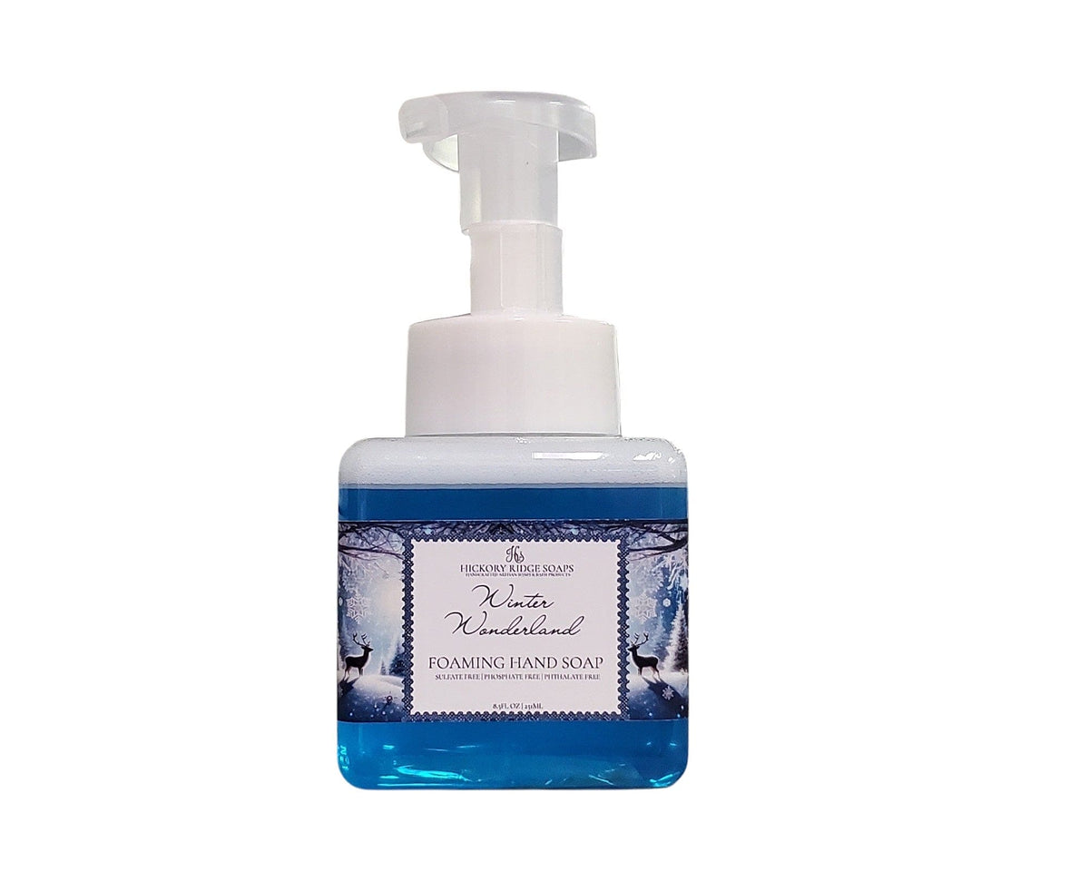 Foaming hand soap bottle with winter-themed design on a white background