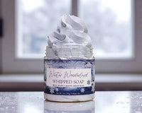 Jar of whipped soap with a label on a reflective surface